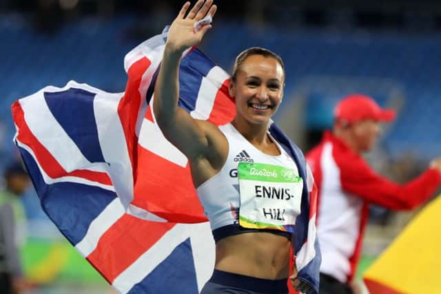 Jessica Ennis-Hill enjoys her lap of honour after winning silver. PICTURE: Owen Humphreys/PA Wire