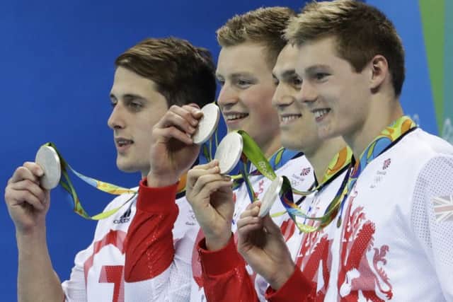 Chris Walker-Hebborn, Adam Peaty, James Guy and Duncan Scott show off their silver medals after the mens 4x100m medley relay final. Picture: AP