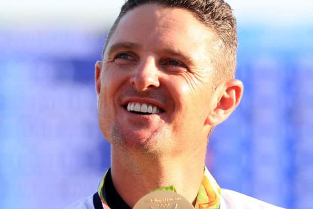 Justin Rose celebrates with his gold medal yesterday. Picture: PA