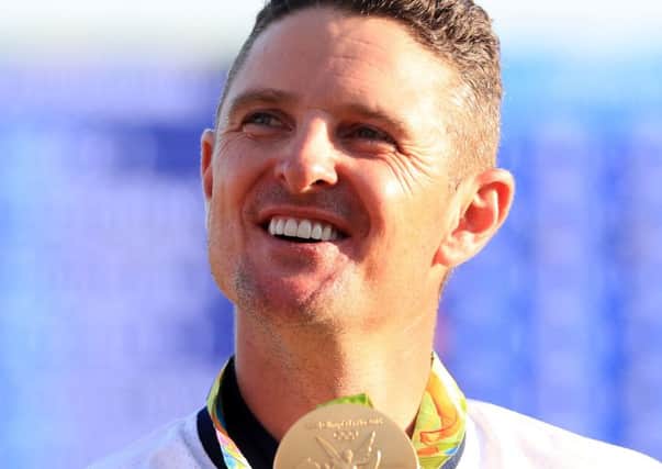 Justin Rose celebrates with his gold medal yesterday. Picture: PA