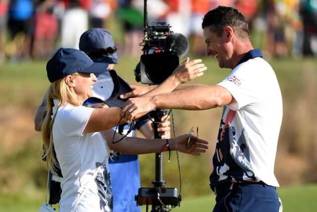 Justin Rose celebrates his Olympic gold medal with wife Kate. PICTURE: Getty