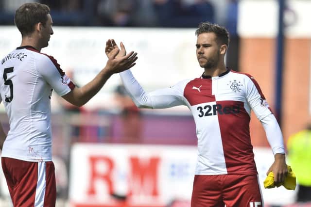 Harry Forrester celebrates victory - but should the former Doncaster Rovers man have been sent off? Picture: Rob Casey / SNS Group