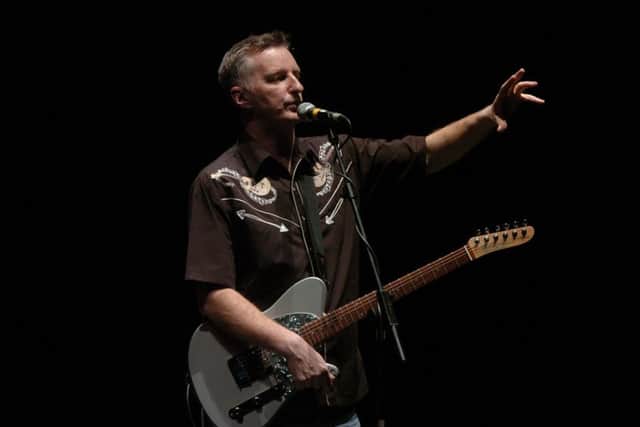 Billy Bragg playing at the Usher Hall