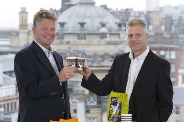 Tchibo's Nick Snow, left, drinks to the deal with Matthew Algie boss Gary Nicol. Picture: Martin Shields