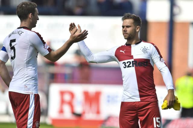 Harry Forrester, right, was at the centre of the action as Rangers defeated Dundee. Picture: SNS