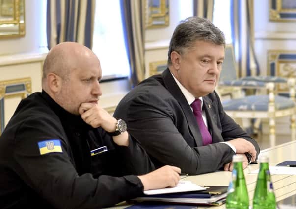 Ukraine's President Petro Poroshenko, right, and Oleksandr Turchynov, Head of Ukraine's Defence and Security Council. Picture: AP
