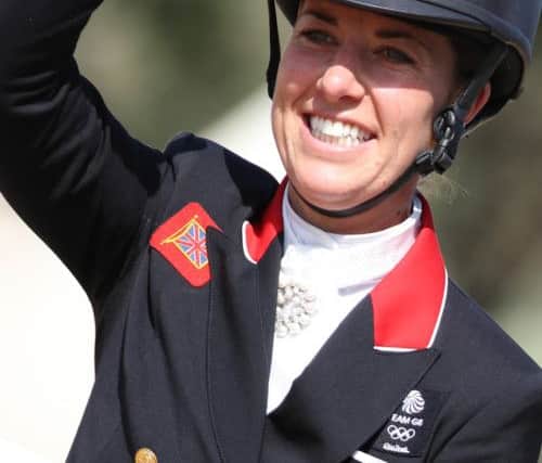 Alamy Live News. GJDTRY Rio de Janeiro, Brazil. 15th Aug, 2016. Gold medalist Charlotte Dujardin (Valegro) of Great Britain celebrates during the medal ceremony of the Dressage Individual Grand Prix Freestyle of the Equestrian events in Deodoro during the Rio 2016 Olympic Games at the Olympic Equestrian Centre in Rio de Janeiro, Brazil, 15 August 2016. Photo: Friso Gentsch/dpa/Alamy Live News This is an Alamy Live News image and may not be part of your current Alamy deal . If you are unsure, please contact our sales team to check.