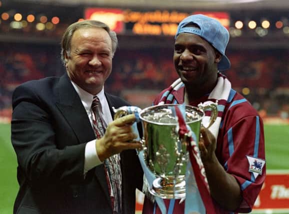 Former Aston Villa manager Ron Atkinson holding the Coca-Cola cup with Dalian Atkinson. Picture: PA
