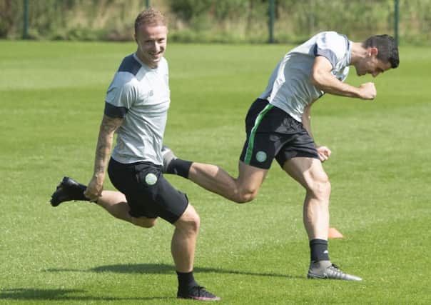 Leigh Griffiths, left, and Tom Rogic in training yesterday. Griffiths praised his manager for allowing players time off training to walk their children to their first day at school. Picture: SNS
