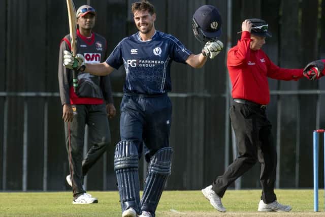 Calum MacLeod celebrates his century for Scotland against the UAE in Edinburgh. Picture: Donald MacLeod/Cricket Scotland
