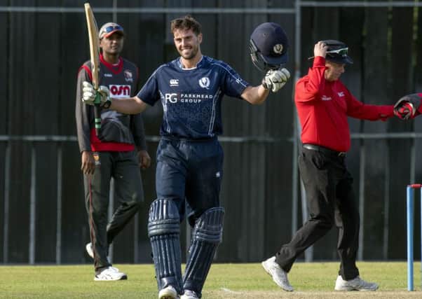 Calum MacLeod celebrates his century for Scotland against the UAE in Edinburgh. Picture: Donald MacLeod/Cricket Scotland