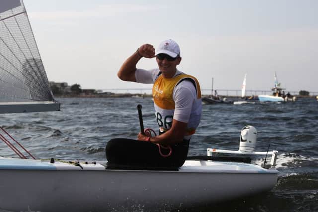 Giles Scott of Great Britain celebrates winning gold in the Finn class at the Marina da Gloria. Picture: Clive Mason/Getty Images