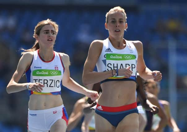 Lynsey Sharp crosses the line ahead of Serbia's Amela Terzic in the women's 800m heats. Picture: AFP/Getty Images