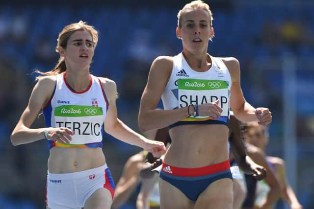 Lynsey Sharp crosses the line ahead of Serbia's Amela Terzic in the women's 800m heats. Picture: AFP/Getty Images