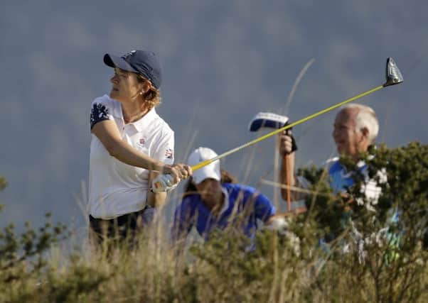 Catriona Matthew watches her tee shot on the 2nd hole. Picture: Alastair Grant/AP