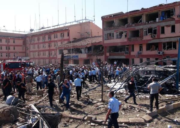 Turkish authorities search outside a damaged building after an explosion in Elazig, eastern Turkey. Picture: Sahismail Gezici/DHA via AP