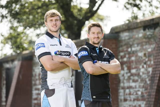 Joint captains Jonny Gray and Henry Pyrgos help to launch Glasgow Warriors new kit yesterday. Picture: SNS