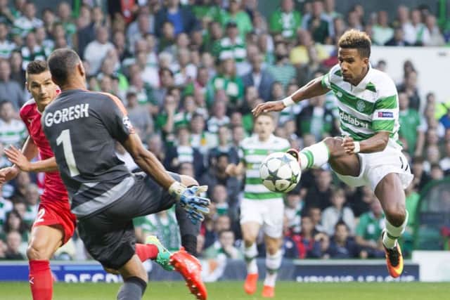 Scott Sinclair tries to lift the ball over David Goresh in the build-up to Celtic's opener. Picture: PA