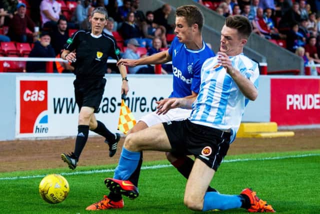 Rangers' Andrew Dallas, left, battles with Stenhousemuir's Fraser Kerr at Forthbank. Picture: Ross Parker/SNS Group