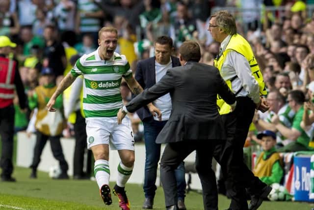 Leigh Griffiths celebrates with manager Brendan Rodgers as he puts Celtic 2-0 in front. Picture: Craig Foy/SNS
