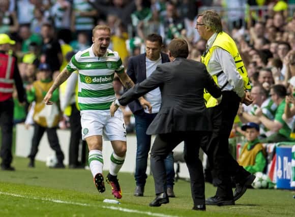 Leigh Griffiths celebrates with manager Brendan Rodgers as he puts Celtic 2-0 in front. Picture: Craig Foy/SNS