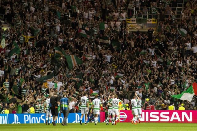 Celtic players celebrate with the fans at full time. Picture: SNS