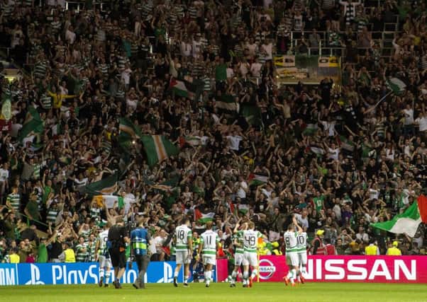 Celtic players celebrate with the fans at full time. Picture: SNS