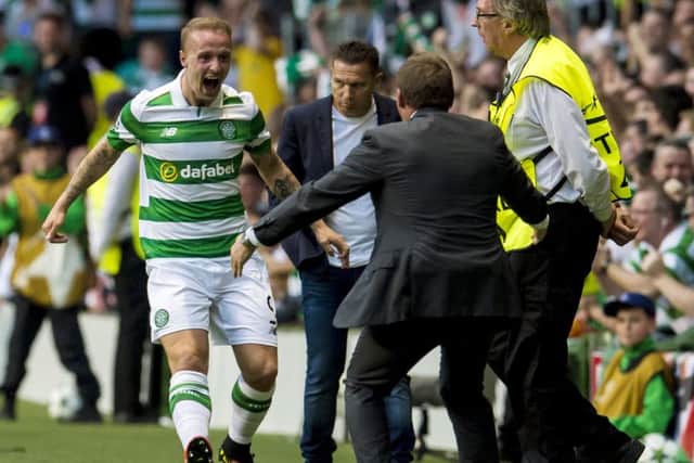 Leigh Griffiths celebrates with manager Brendan Rodgers after putting Celtic 2-0 in front. Picture: John Devlin