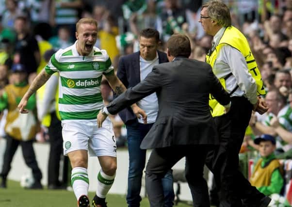 Leigh Griffiths celebrates with manager Brendan Rodgers after putting Celtic 2-0 in front. Picture: John Devlin