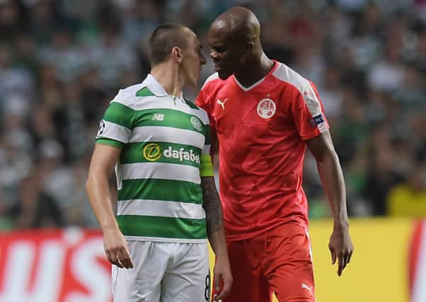 Celtic's Scott Brown confronts Hapoel's Anthony Nwakaeme. Picture: Craig Williamson/SNS