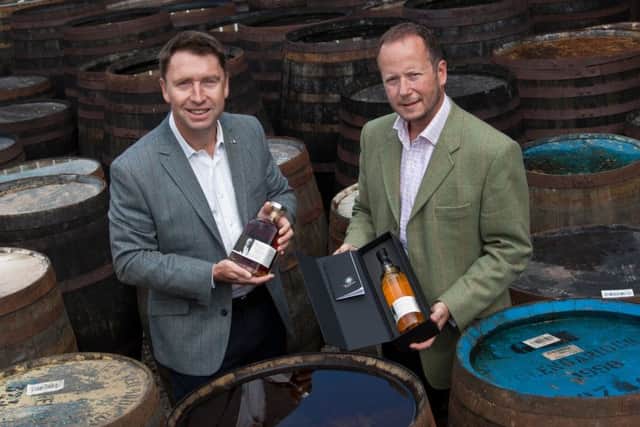 TBG's David Moore, left, with Alex Bruce of distiller Adelphi. Picture: Contributed