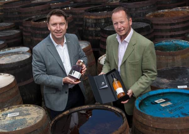 TBG's David Moore, left, with Alex Bruce of distiller Adelphi. Picture: Contributed