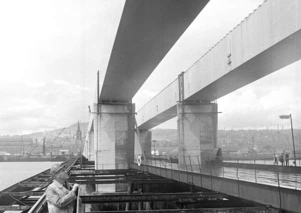 An engineer surveys construction of the Tay Road Bridge. Picture: TSPL
