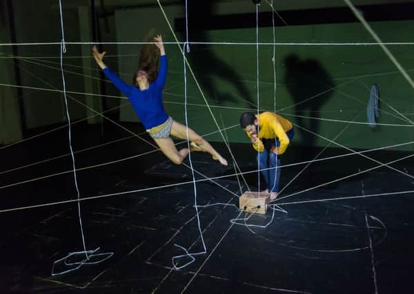Gytha Parmentier and Roman Van Houtven play amoung the detonators