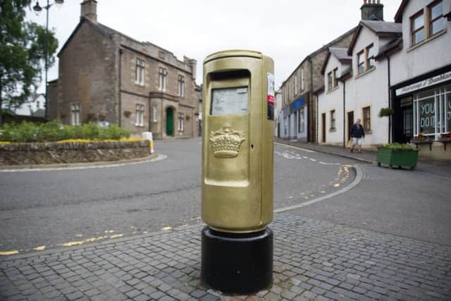 A gold post box in Dunblane in honour of Andy Muray. Picture: John Devlin