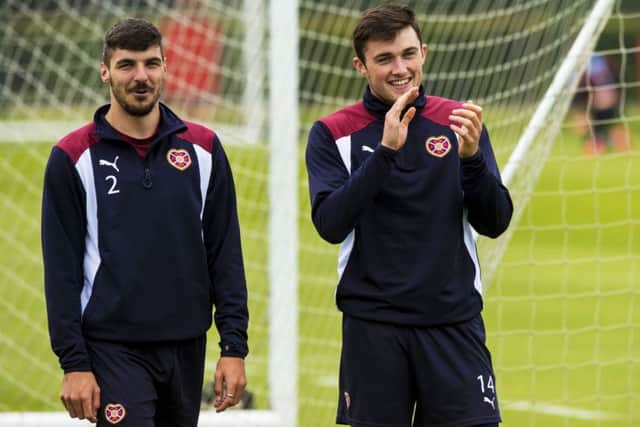 Hearts' Callum Paterson, left, at training with John Souttar. Picture: SNS