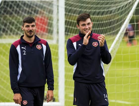 Hearts' Callum Paterson, left, at training with John Souttar. Picture: SNS