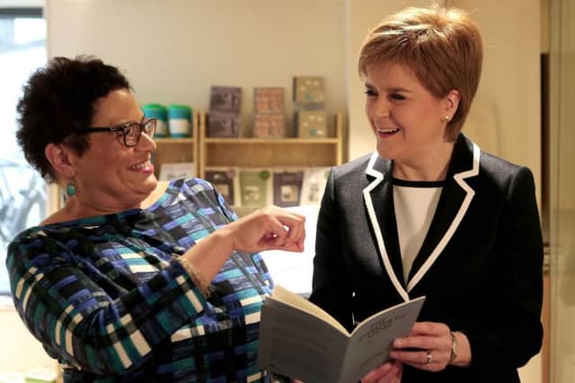 First Minister Nicola Sturgeon is shown a poem written by the new Makar (National Poet for Scotland) Jackie Kay Picture: Andrew Milligan