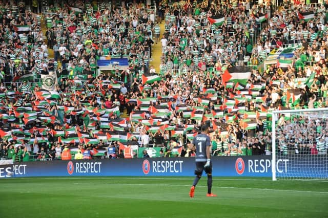 Celtic fans show their support for Palestine at Wednesday's match. Picture: John Devlin