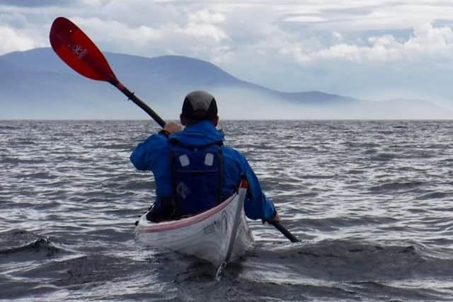 A lone kayaker enjoys the views near Inchmarnock. Picture: Sea Kayak Argyll