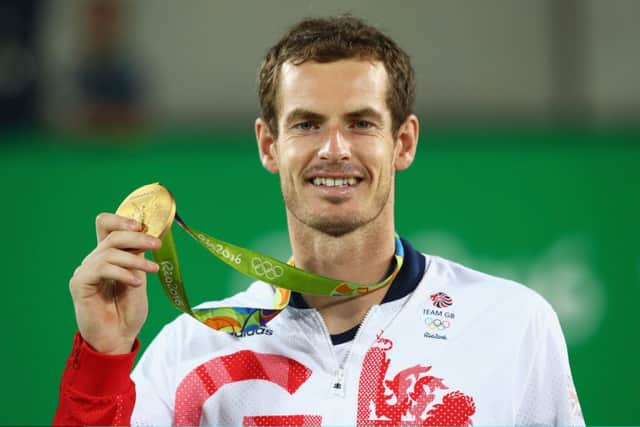 Gold medalist Andy Murray of Great Britain poses on the podium during the medal ceremony for the men's singles. (Photo by Clive Brunskill/Getty Images)