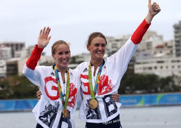 Gold medalists Helen Glover (left) and Scot Heather Stanning (right) celebrate at the medal ceremony for the Women's Pair. Picture: Getty Images