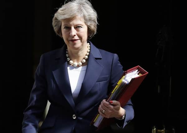 Prime Minister Theresa May insists Brexit means Brexit but there are few details of formal exit proceedings. Photograph: AP/Frank Augstein