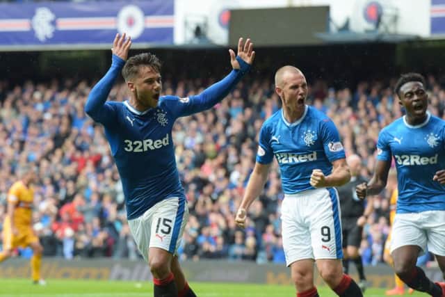 Harry Forrester celebrates his equaliser with Kenny Miller, who would later net Rangers' winner. Picture: Alan Harvey/SNS
