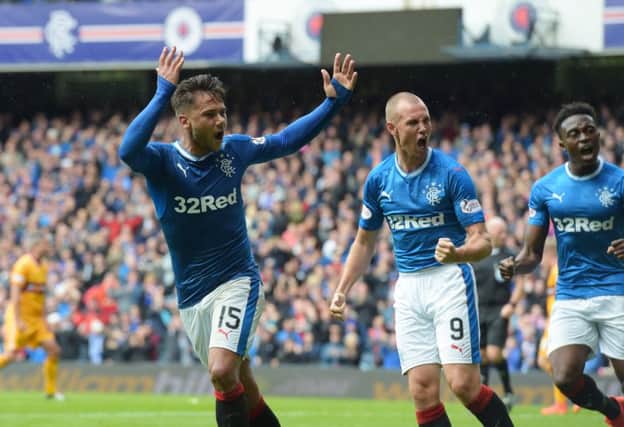 Harry Forrester celebrates his equaliser with Kenny Miller, who would later net Rangers' winner. Picture: Alan Harvey/SNS