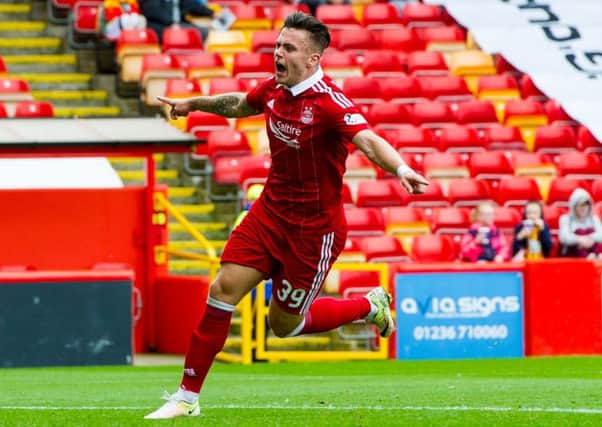 Miles Storey wheels away in delight after scoring his first goal for Aberdeen. Pic: Ross Parker/SNS