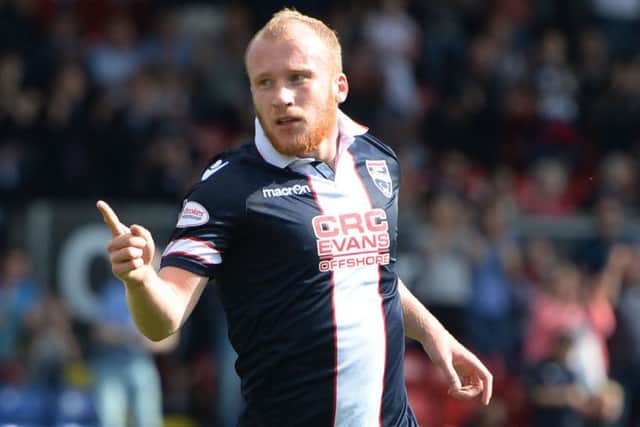 Liam Boyce celebrates opening the scoring as Ross County defeated Kilmarnock. Pic: SNS