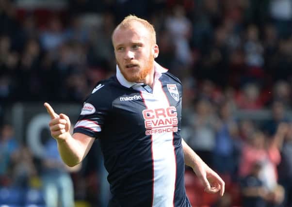 Liam Boyce celebrates opening the scoring as Ross County defeated Kilmarnock. Pic: SNS