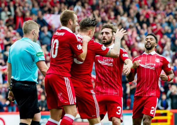Aberdeen celebrate after Miles Storey put them two ahead with his first goal for the club on Saturday. Picture: SNS