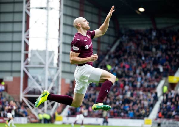 Conor Sammon, who had been judged harshly by some sections of the Hearts support, celebrates scoring his sides second goal against Inverness on Saturday. Picture: SNS